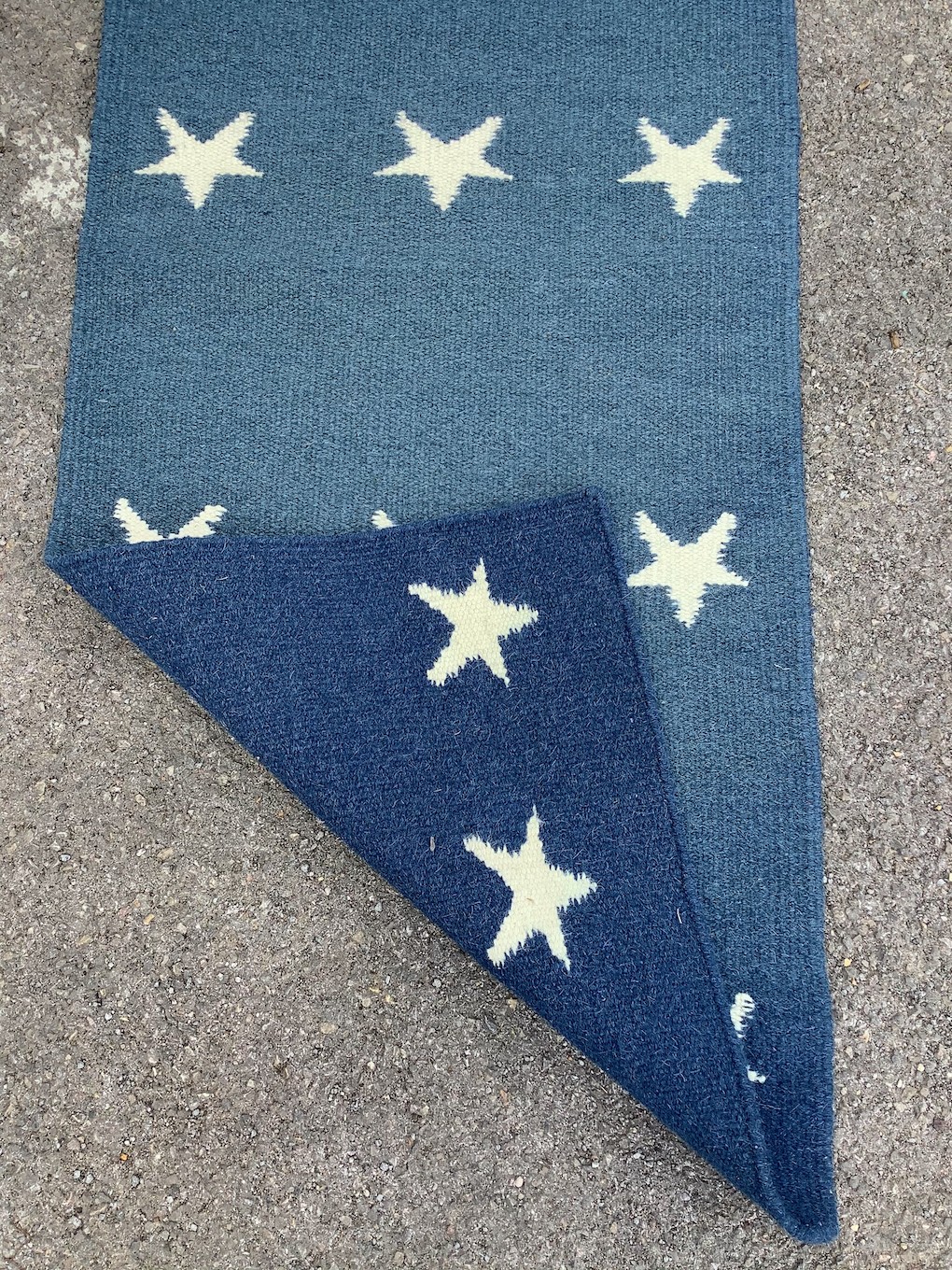 A contemporary wool runner with star motifs, 300 x 76cm